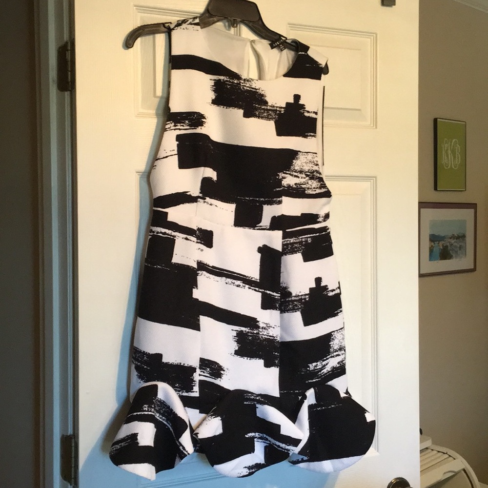 Chic and smart black and white dress with ruffle